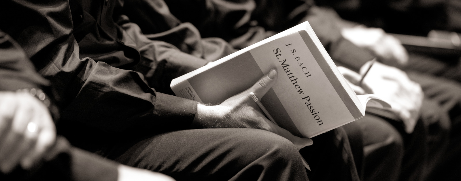 The Bach Choir St Matthew Passion Image of Choir Member holding Song Book of St Matthew Passion